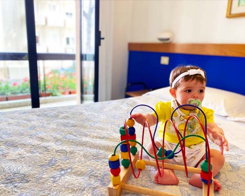 Little girl has fun on the bed